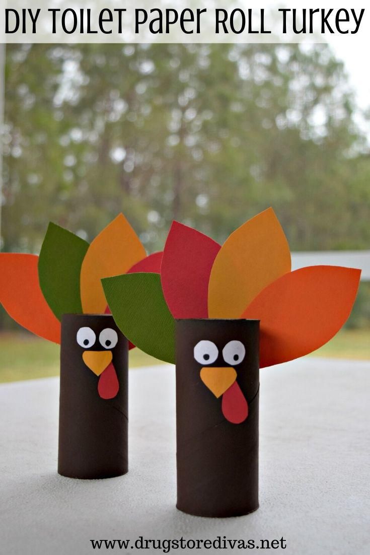 two toilet paper roll turkeys sitting on top of a table