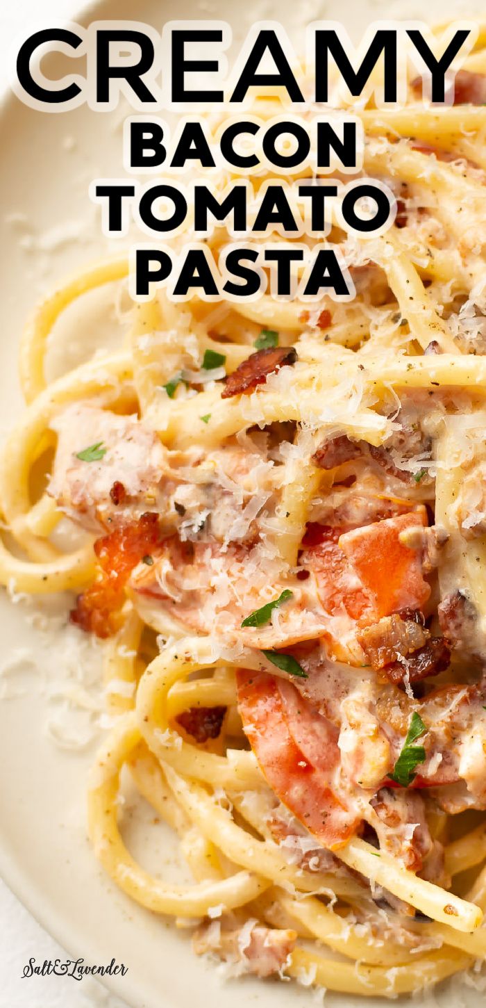 creamy bacon tomato pasta on a white plate