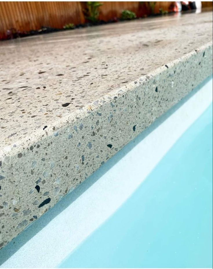 a close up view of a pool with blue water