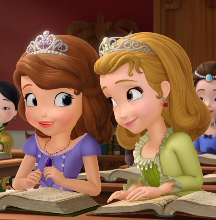 the princess and the frog are sitting at desks with books in front of them