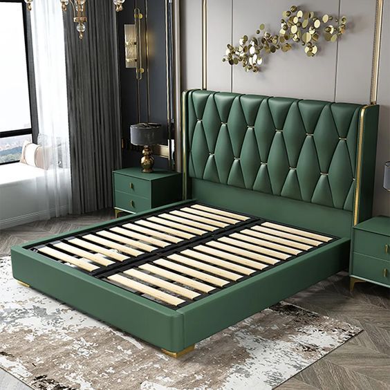 a green bed frame in a bedroom with two nightstands and a mirror on the wall