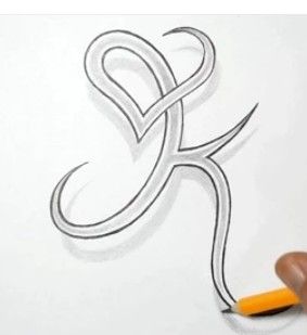 someone is drawing the letter k with a pencil