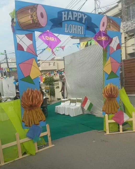 an arch decorated with colorful paper decorations for a festival