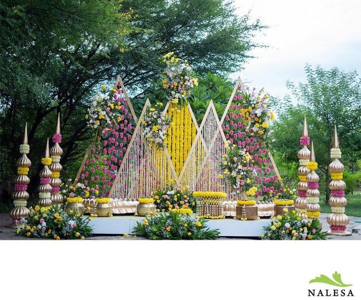 an elaborate flower display in the middle of a park