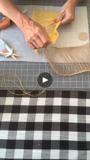 a person is working with fabric on a table