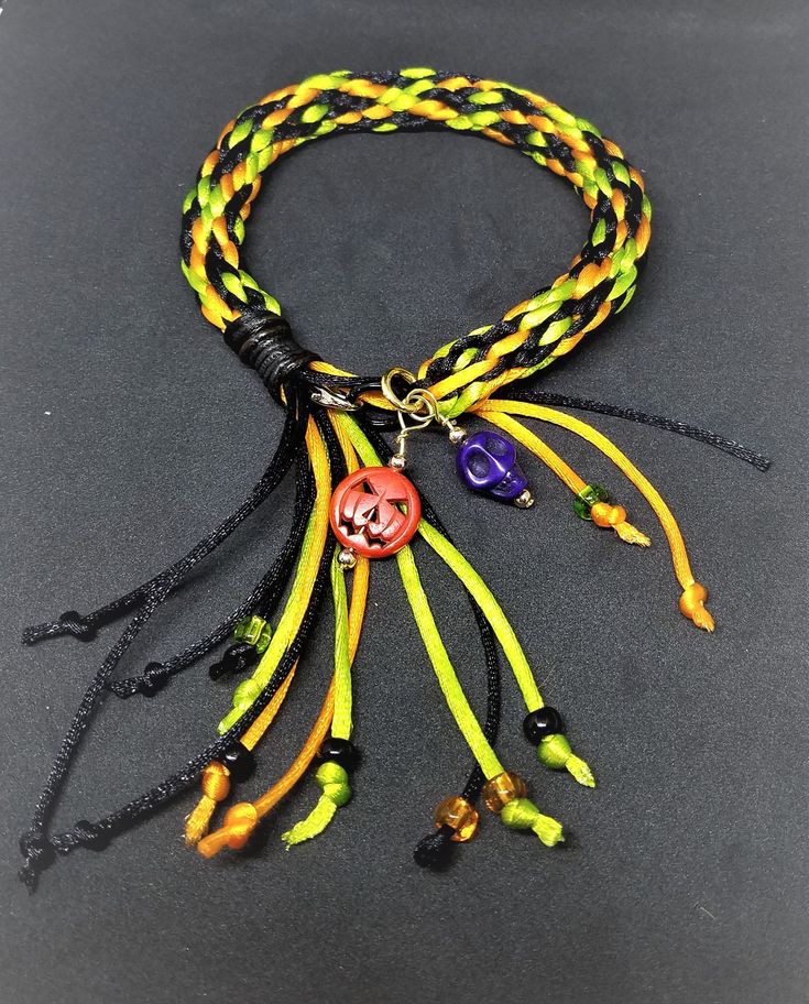 For that creepy person in your life who loves all things Halloween, this hand-braided bracelet will add some fun to their October. It features bone pumpkins, ceramic skulls, and glass beaded fringe on a spooky band of green, orange, and black silk cording. Check out the similarly made anklet in my store for double the fun...Trick-or-Treat!! Handmade Halloween Festival Bracelets, Handmade Halloween Festival Bracelet, Handmade Bohemian Bracelets For Halloween, Bohemian Handmade Bracelets For Halloween, Handmade Adjustable Bracelets For Halloween, Handmade Casual Halloween Jewelry, Casual Handmade Jewelry For Halloween, Casual Handmade Halloween Jewelry, Creepy Person