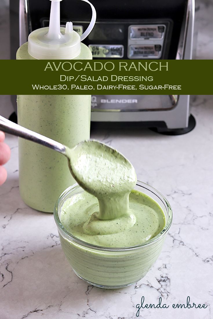 avocado ranch dip / salad dressing in a glass bowl with a spoon inside