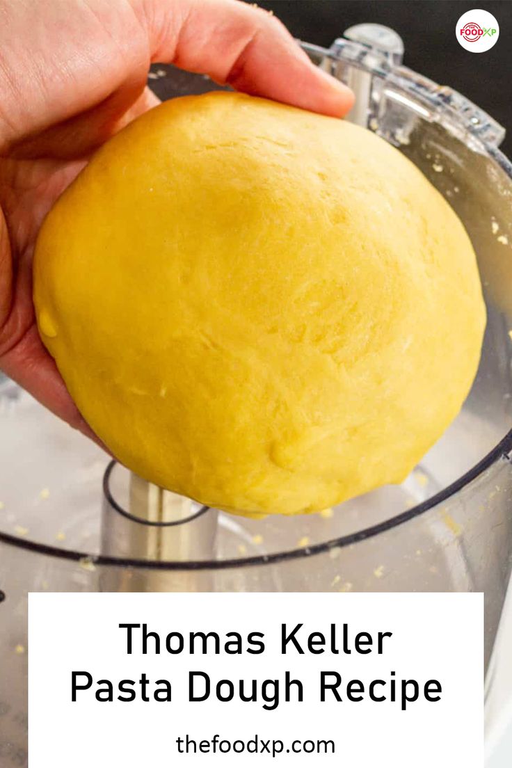 a person holding a doughnut in a food processor with the words thomas keller pasta dough recipe