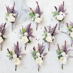 wedding bouquets with flowers arranged on a white surface