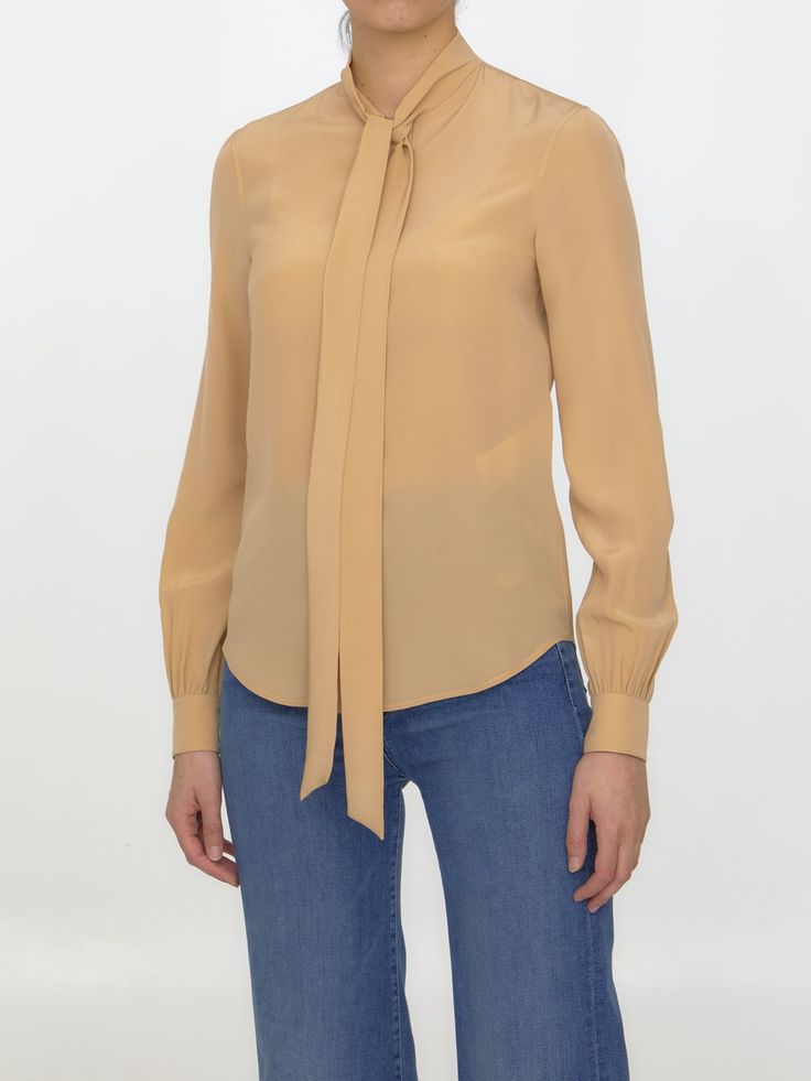 100% Silk | Saint Laurent Women's Bow Collar Plain Shirt in Beige | SS23 Designer Silk Tops For Work, Classic Silk Tops For Fall, Classic Silk Tops With Relaxed Fit, Designer Spring Tops For Workwear, Spring Designer Office Tops, Designer Silk Tops For Fall, Designer Tops For Work In Fall, Designer Tops With Relaxed Fit For Formal Occasions, Luxury Relaxed Fit Workwear Tops