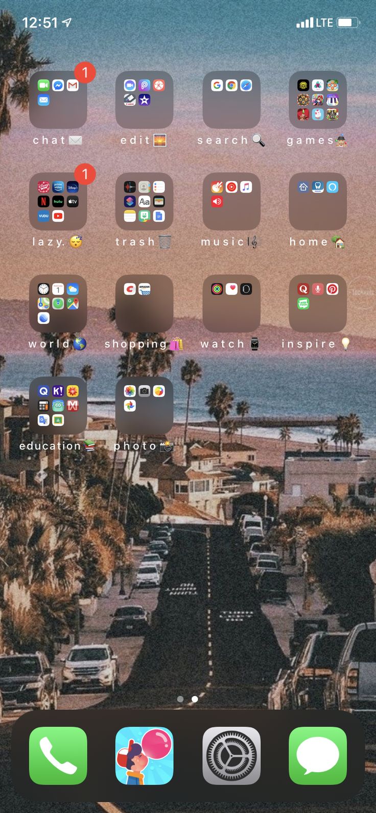 an iphone screen with the view of a beach and ocean in the background, including icons