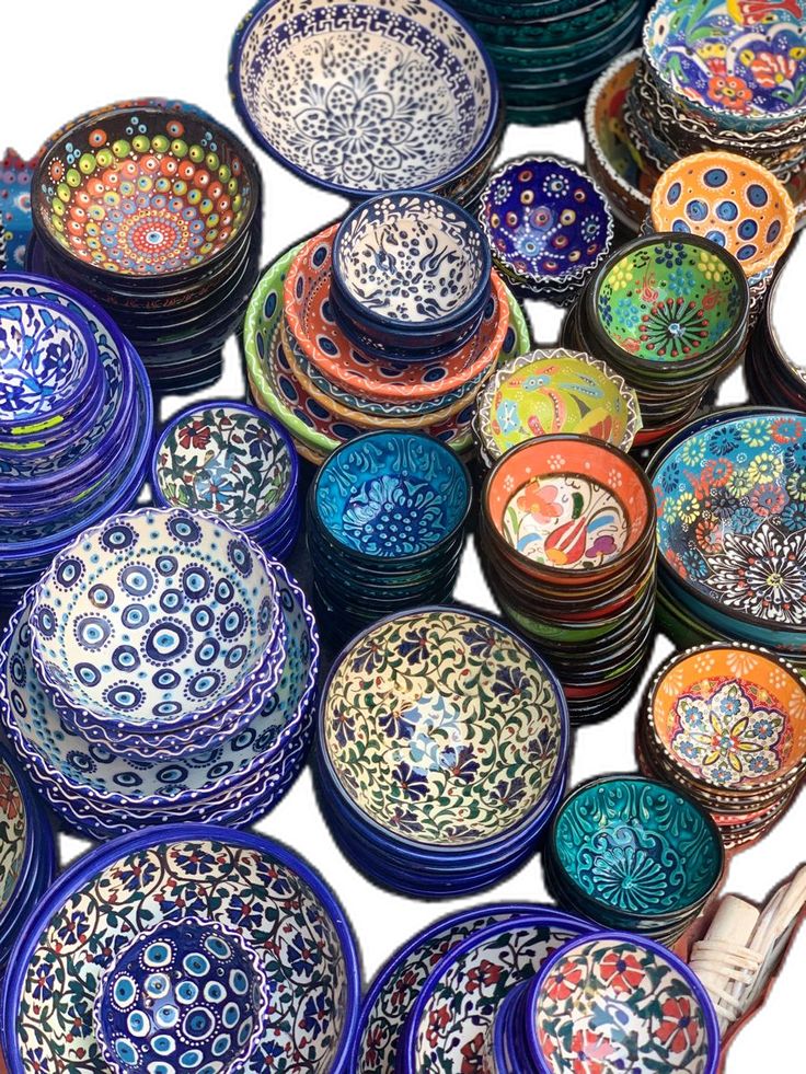 many colorful bowls are stacked on top of each other