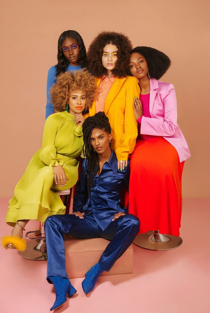 the cover of nylon magazine featuring four women in colorful outfits and one man sitting on a chair