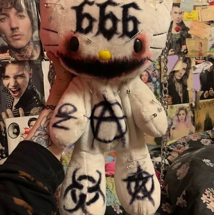 a hello kitty stuffed animal with the word boo written on it