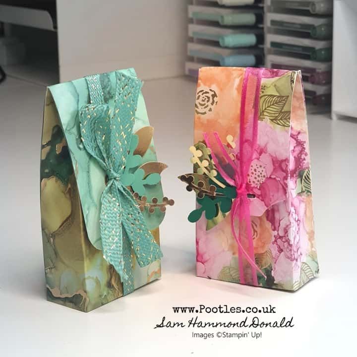 two small gift bags sitting next to each other