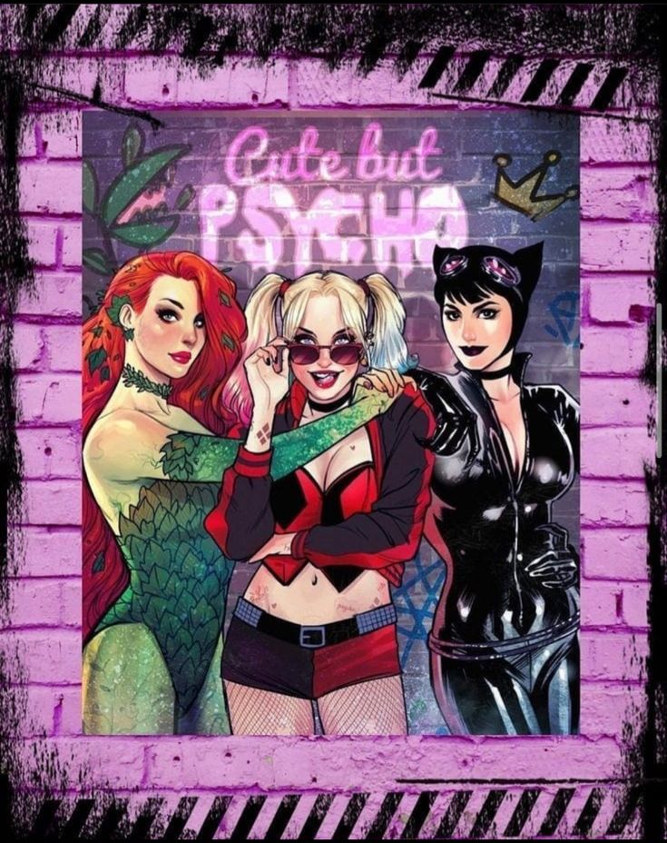 three women dressed in catwoman costumes standing next to a brick wall with graffiti on it