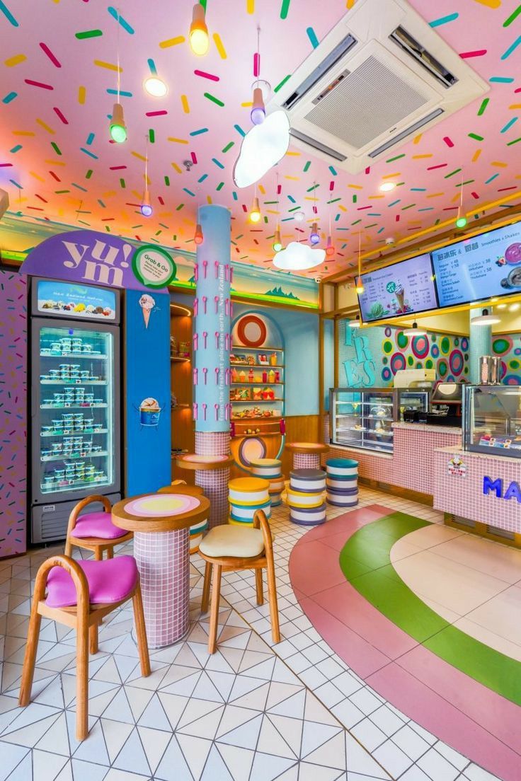 the inside of a doughnut shop with sprinkles on the ceiling