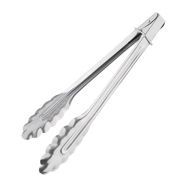 two metal tongs sitting on top of each other