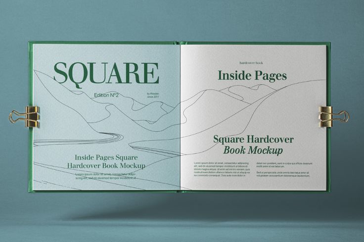 the inside pages of a square book mockup on a blue background with clippings