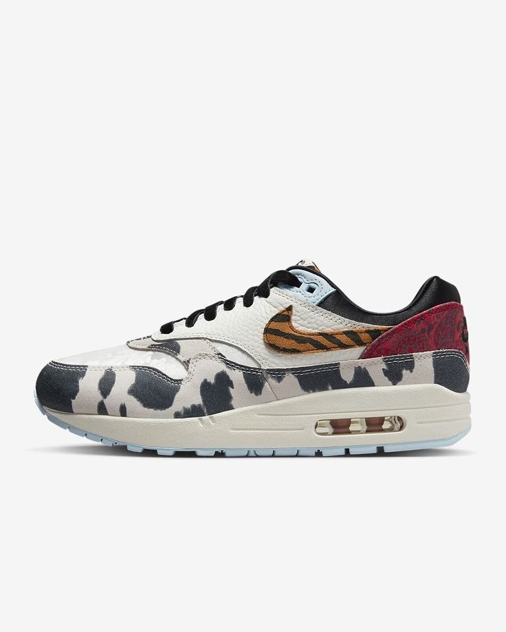 Women’s Nike Air Max 1 ‘87 “Great Indoors” Captivating and thumping with bold prints and textures, the Air Max 1 '87 is the statement piece every 'fit needs. Inspired by what the hottest sneaker boutique would look like, we've upped the opulence with warm earth tones and unexpected patterns that nod to sophisticated upholstery and area rugs. From velvety laces to a silky black liner and icy blue outsole, these kicks take decor dominance to a brand-new level. Ready to hang? Benefits * Upper features leather and suede for added durability that's made for everyday wear and city life. * Originally designed for performance running, visible Nike Air cushioning puts the history of comfort beneath your feet. * Padded, low-cut collar looks sleek and feels great. Product Details * Rubber outsole * F Air Max One, Nike Snkrs, Sneaker Boutique, Pattern Shoes, Nike Models, Fall Over, Air Max Shoes, Black Liner, Nike Air Max For Women