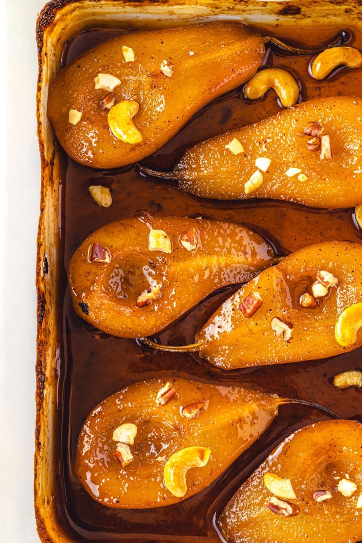 baked sweet potatoes with walnuts and chocolate in a casserole dish, ready to be eaten