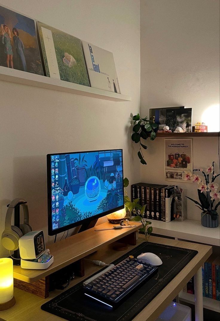 a computer monitor sitting on top of a wooden desk