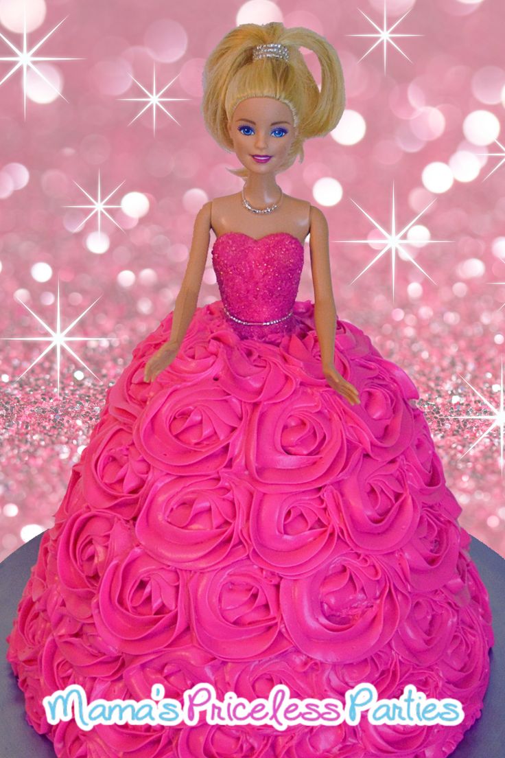 a barbie doll cake with pink frosting on it's face and dress made out of roses