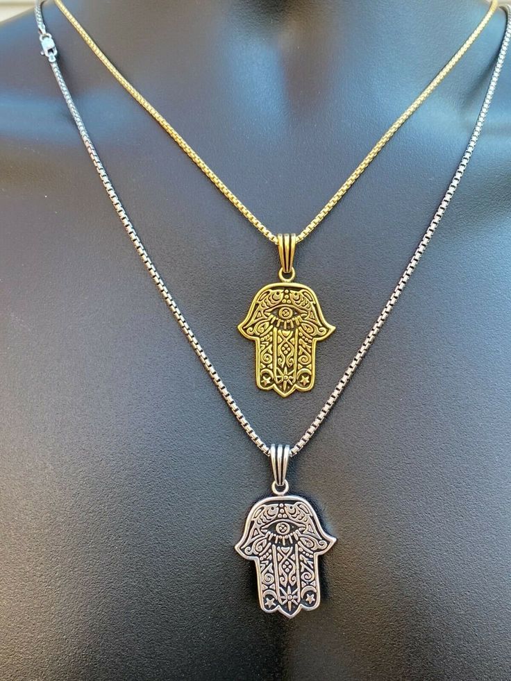 "Beautifully Hand crafted Hamsa pendants **IF YOU WANT A PENDANT ONLY AND NO CHAIN, PLEASE SELECT \"0\" CHAIN LENGTH** Solid 925 sterling silver! Unique custom made one of a kind! We have 2 styles! Rhodium finished & 14k yellow gold finished! Gold is vermeil bonded to solid silver underneath so color wont fade or tarnish Both are oxidized (blackened to give a more vintage look) Pendant measures roughly 1.25\" by 1.25\" (1.75\" w. bale)...weighs roughly 10.5 grams! 100% 925 silver...not plate Symbolic Silver Chain Jewelry As Gift, Sterling Silver Tarnish Resistant Charm Necklaces For Jewelry Making, Gold Pendant Charm Necklaces With Silver Chain, Gold Pendant Charm Necklace With Silver Chain, Silver Tarnish Resistant Pendant Charm Necklace, Spiritual Style Silver Chain Jewelry Gift, Hand Of God, Hamsa Pendant, Eye Pendant