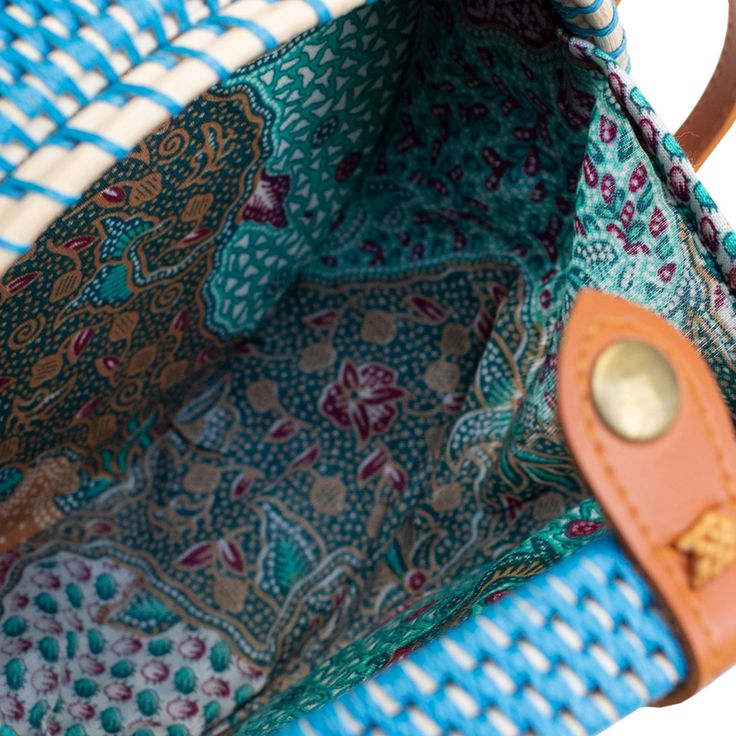 The Ata Bali is the must-have crossbody bag for all of your warm-weather events - from vacations to beach days. Keep your belongings secure with the Snap closure and the beautiful fabric-lined interior. Wipe Clean / Rattan Beach Crossbody Shoulder Bag With Removable Pouch, Rectangular Beach Bags With Adjustable Straps, Crossbody Shoulder Bag With Removable Pouch For Beach, Summer Straw Bag With Removable Pouch For Travel, Blue Woven Beach Bag For Beach Season, Summer Crossbody Beach Bag With Removable Pouch, Blue Woven Beach Bag, Blue Woven Bags For Beach Season, Beach Crossbody Straw Bag With Removable Pouch