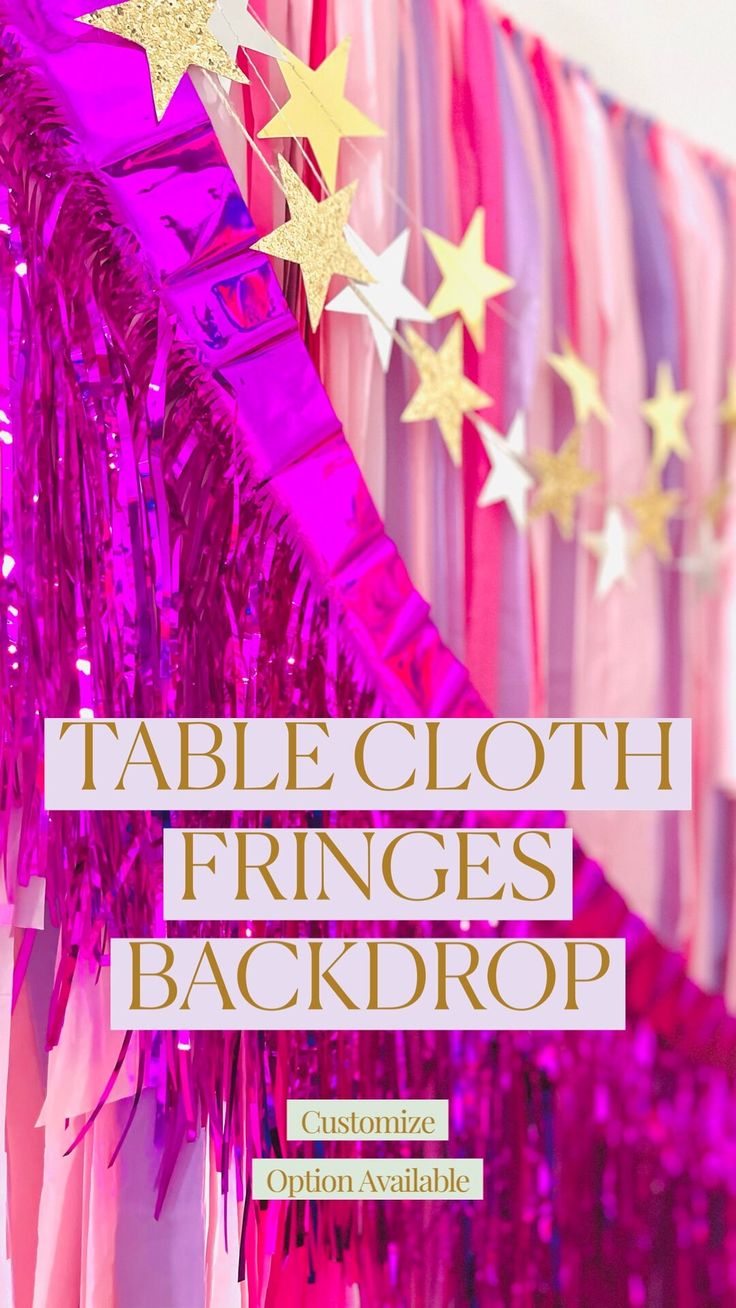 a table cloth with fringes and stars hanging from the ceiling in front of it