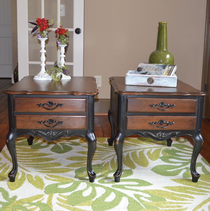 two wooden nightstands sitting on top of a rug