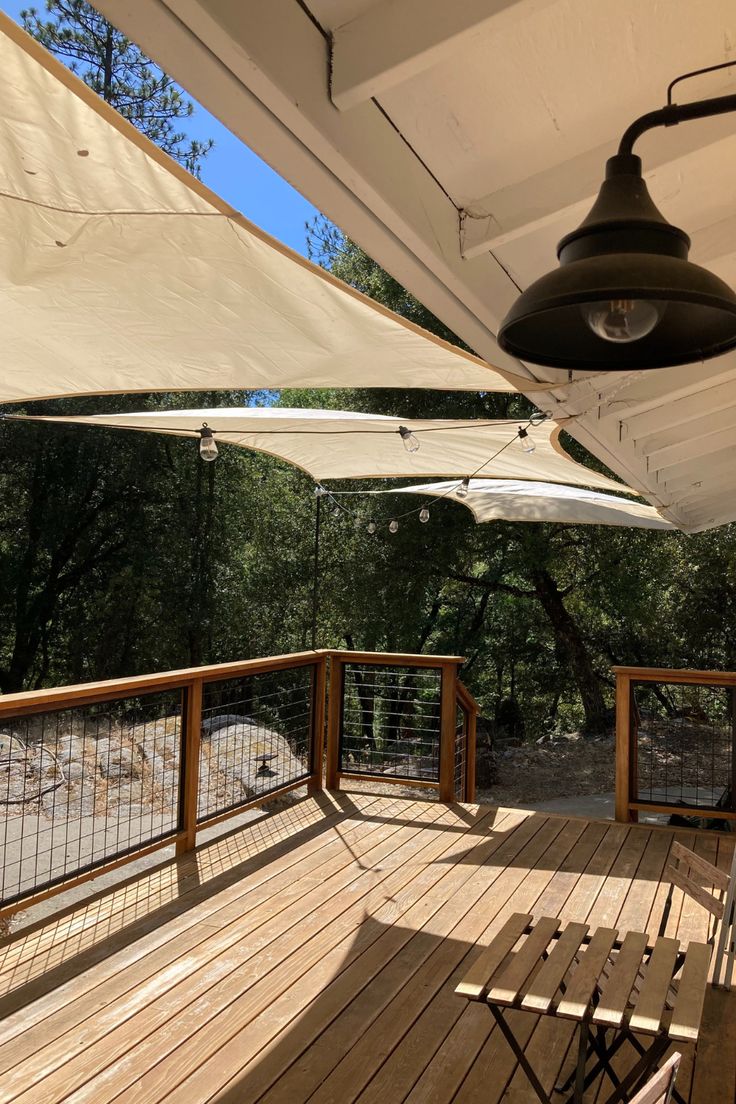 a wooden deck with an umbrella over it