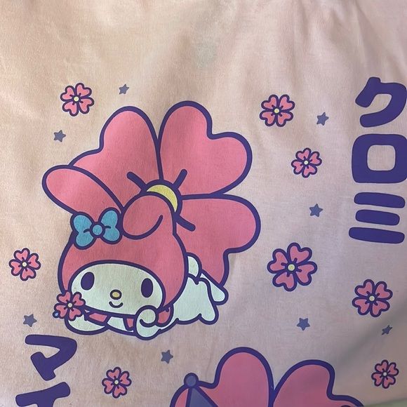 Pink Hello Kitty Friends My Melody And Kuromi T-Shirt In Pristine Brand New Condition. Pink Crew Neck T-shirt With Cute Design, Cute Crew Neck T-shirt, Purple Cotton Kawaii Top, Cute Pink T-shirt With Funny Print, Purple Harajuku Crew Neck Top, Harajuku Style Purple Short Sleeve Top, Harajuku Style Short Sleeve Purple Tops, Cute Cartoon Print Tops, Cute Pink T-shirt With Cartoon Print