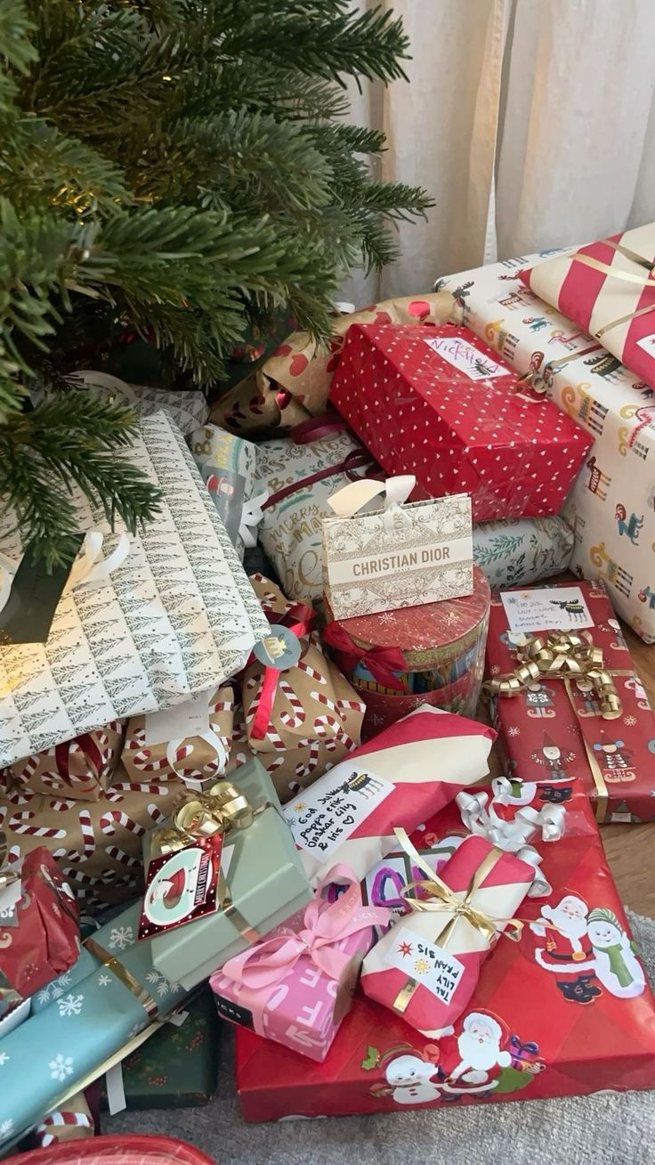 presents under a christmas tree on the floor