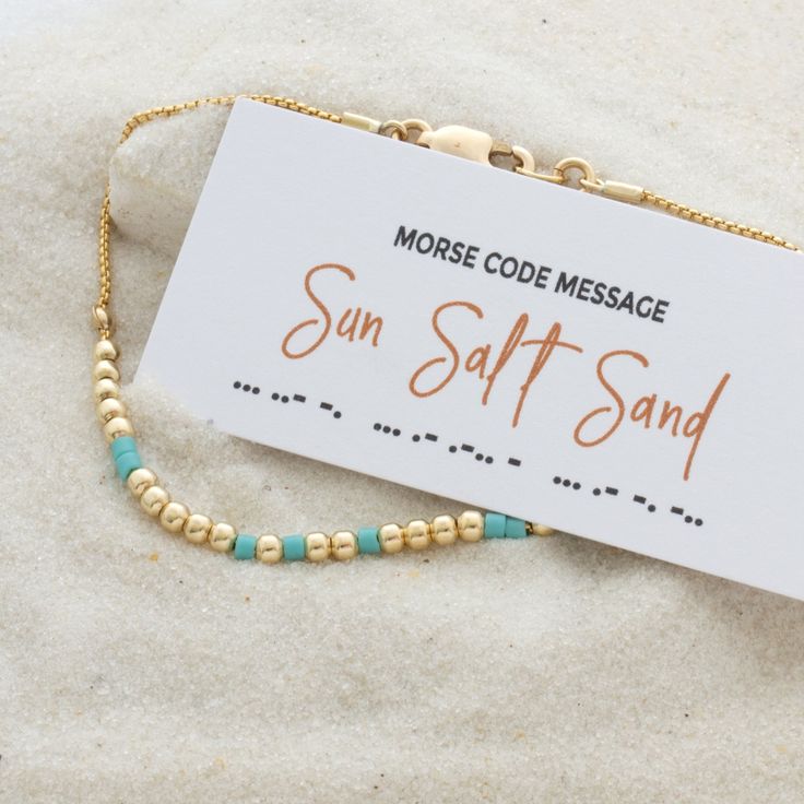 Capture the essence of beach life with our "Sun Sand Salt" Morse code bracelet. This bracelet features beads that spell out its message in Morse code, allowing you to carry the spirit of seaside adventures wherever you go. Whether you're a beach enthusiast or simply love the laid-back coastal lifestyle, this bracelet serves as a reminder to pause and appreciate life's simple pleasures. It's an ideal gift for the ocean lover in your life or a lovely treat for yourself. *listing is for one morse c Summer Gold Beaded Bracelets For Beach, Gold Beaded Bracelets For Summer Beach, Summer Beach Gold Beaded Bracelets, Tiny Beads Bracelets For Beach Season Gift, Adjustable Gold Beaded Bracelets For Beach Season, Gold Strand Beaded Bracelets For Summer, Resizable Gold Beaded Bracelets For The Beach, Gold Beaded Bracelets For Beach Season, Gold Strand Beaded Bracelets For Vacation