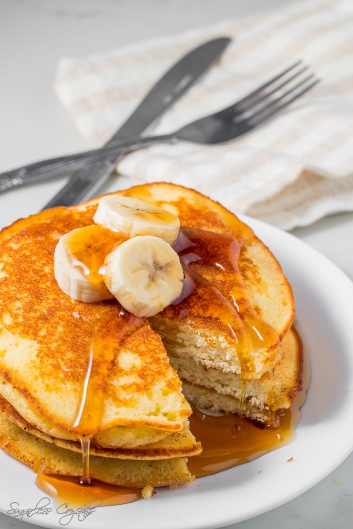 a pancake with bananas and syrup on it