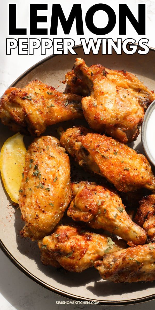 lemon pepper wings on a plate with dipping sauce