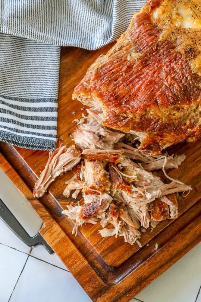 a large piece of meat sitting on top of a cutting board