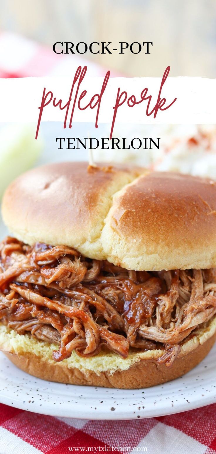 a pulled pork sandwich on a white plate with red and white checkered table cloth