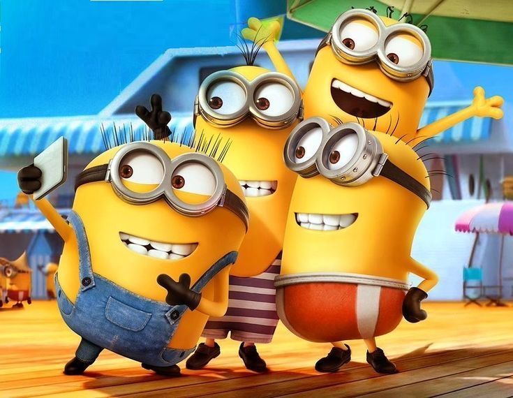 three minions from the movie despicable me standing next to each other