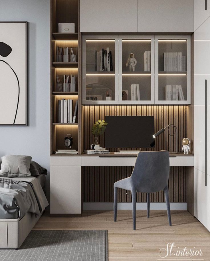 a bedroom with a bed, desk and bookcases on the wall next to it