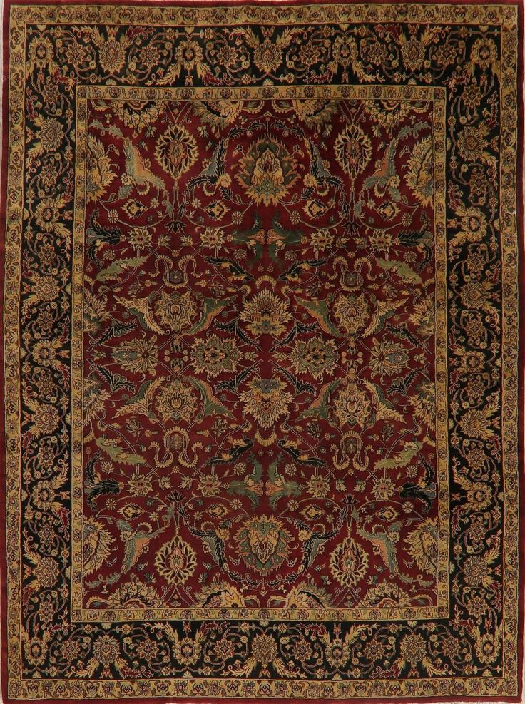 a red and black rug with an ornate design