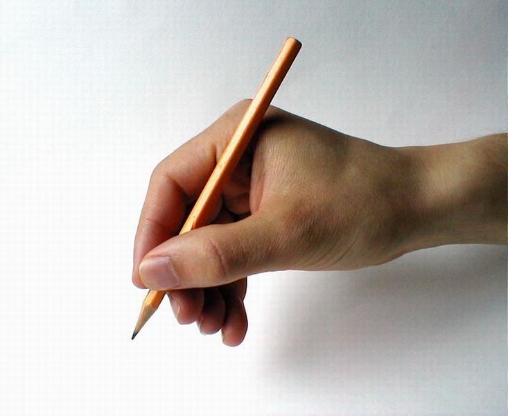 a person's hand holding a pencil and pointing it at the tip of their thumb