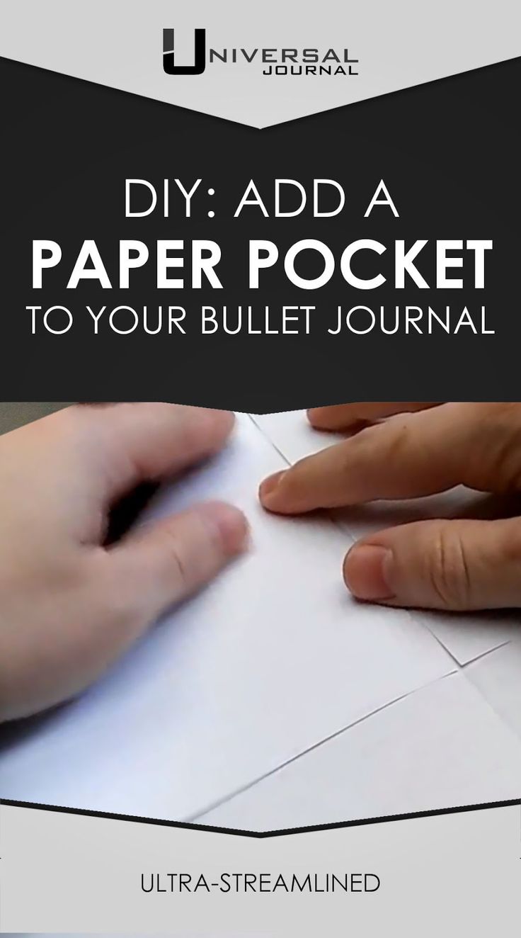 someone is making a paper pocket with their hand on top of the paper, while another person's hands are holding it