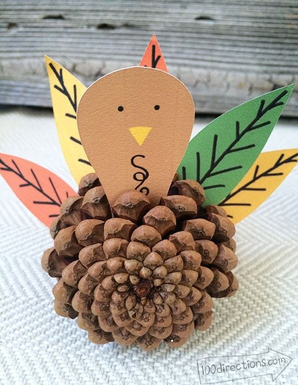 a pine cone with a turkey on it