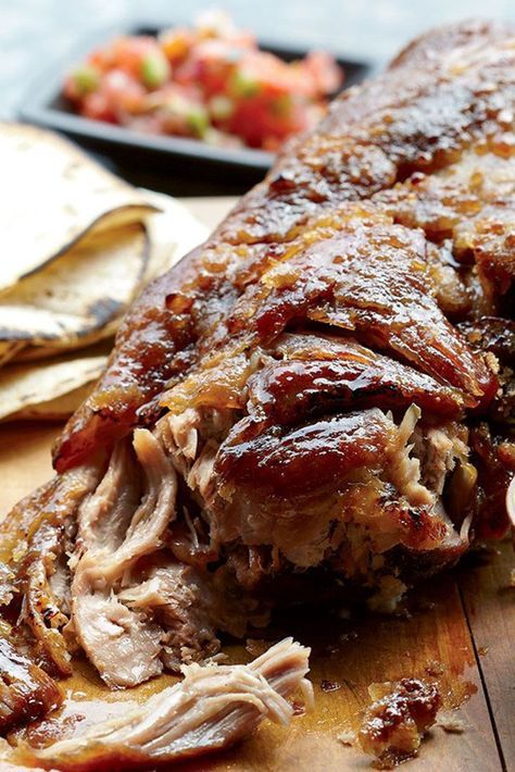 the meat is sliced up and ready to be served on the table with other foods