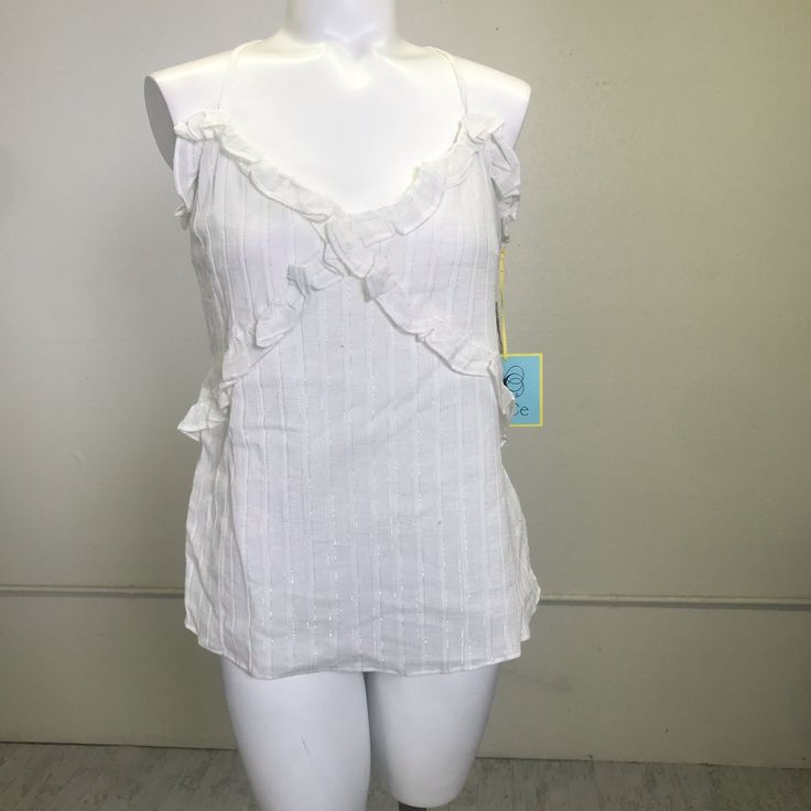 Approx Measurements: Bust Across: 20" Length: 19" Details: V-Neck, Adjustable Straps, Ruffle Trim, Metallic Threading Material: Cotton, Metallic Lining Condition: Nwt M- 0249 Cotton Camisole, Threading, Ruffle Trim, White Silver, Adjustable Straps, Womens Tops, Trim, V Neck, Women's Top