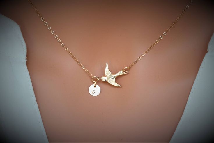 Bird Necklace in 14k gold fill / Sterling silver. Personalized bird necklace. This necklace express for love and friendship All metal components onto High Quality 14k gold fill or Sterling Silver ★This beautiful necklace consists of, -14 k gold fill 20.2x16.7mm Bird Link, -7mm 14k gold fill initial disc and -14k gold fill cable chain with end to end to Spring Claw. -Come up with beautiful ribbon gift box that enhance your present. MORE BIRD https://www.etsy.com/shop/rainbowearring?ref=hdr_shop_m Everyday Gold Hallmarked Jewelry, Adjustable Bird Design Jewelry As Gift, Adjustable Bird Design Jewelry Gift, Gold Jewelry With Bird Design For Wedding, Adjustable Bird Design Jewelry For Gifts, Elegant Bird Design Jewelry For Gift, Elegant Bird Design Jewelry Gift, Elegant Bird Design Jewelry For Anniversary, Gold Wedding Jewelry With Bird Design