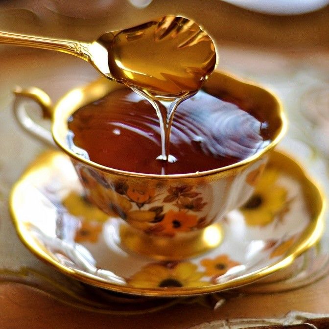 a tea cup filled with liquid on top of a saucer