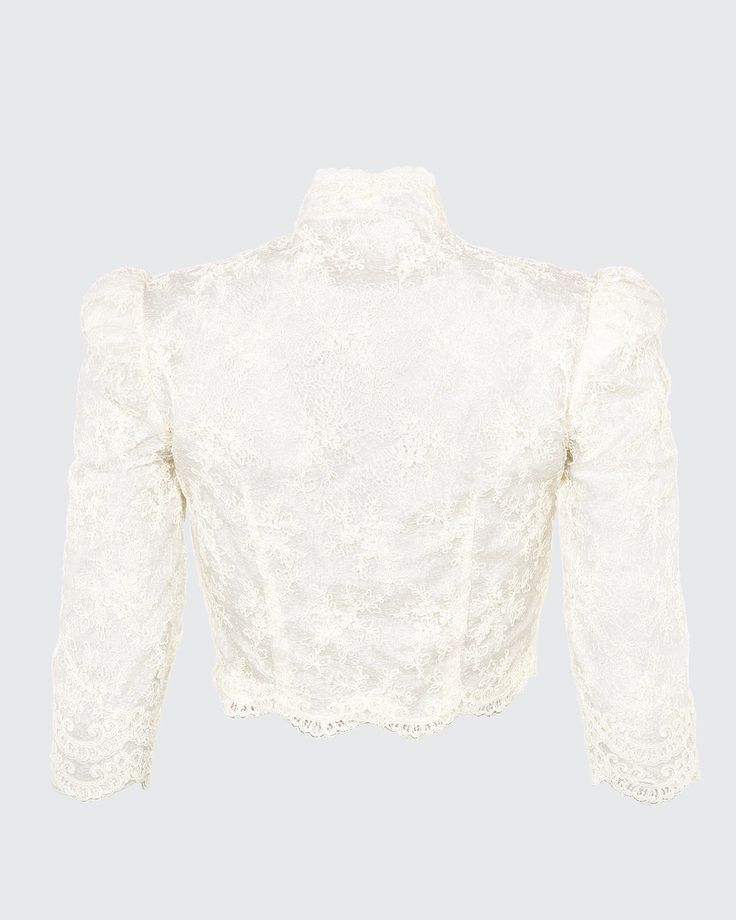 Our Bolero is a cropped scoop top with a mandarine neckline featuring three-quarter, high fitted sleeves. The Bolero is made with embroidered mesh lace and trimmed with an Alençon lace scallop trim. Embroidered mesh lace trimmed with Point d'Alençon Three-quarter sleeves Hook-and-eye closures center front Hand wash and flat dry or dry clean Each piece is made to order and handcrafted in our atelier. Elegant Cropped Lace Top, Long Sleeve Crop Top With Lace Trim For Party, Fitted Cropped Lace Top With Scalloped Edges, Formal Long Sleeve Tops With Scalloped Lace, Elegant Scalloped Lace Cropped Top, Fitted Cropped Lace Top With Scalloped Lace, Long Sleeve Lace Trim Crop Top For Party, Formal Fitted Blouse With Scalloped Lace, Elegant Long Sleeve Lace Crop Top